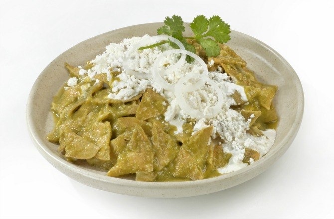 Try the food that can beat all hangovers: chilaquiles.